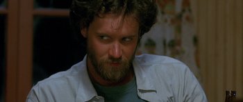Movie still from “Jaws: The Revenge” (1987), directed by Joseph Sargent – A person with a beard; Close Up shot, Low angle