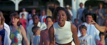 Movie still from “Jaws: The Revenge” (1987), directed by Joseph Sargent – A group of people standing in front of each other; Close Up shot, Low angle