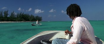 Movie still from “Jaws: The Revenge” (1987), directed by Joseph Sargent – Two people in a boat in the water; Wide shot, High angle
