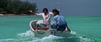 Movie still from “Jaws: The Revenge” (1987), directed by Joseph Sargent – Two people on a boat in the water; Wide shot, Low angle