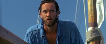 Movie still from “Jaws: The Revenge” (1987), directed by Joseph Sargent – A person with a beard; Close Up shot, Low angle