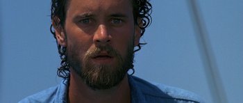 Movie still from “Jaws: The Revenge” (1987), directed by Joseph Sargent – A person with a beard; Close Up shot, Low angle