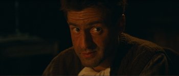 Movie still from “Jean de Florette” (1986), directed by Claude Berri – A person looking at the camera; Close Up shot, Low angle