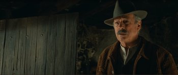 Movie still from “Jean de Florette” (1986), directed by Claude Berri – An older man with a mustache wearing a hat; Close Up shot, Low angle