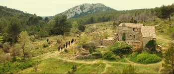 Movie still from “Jean de Florette” (1986), directed by Claude Berri – A group of horses walking down a dirt road; Extreme Wide shot, High angle