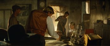 Movie still from “Jean de Florette” (1986), directed by Claude Berri – A man and a woman and a little girl in a room; Medium shot, Over the shoulder angle