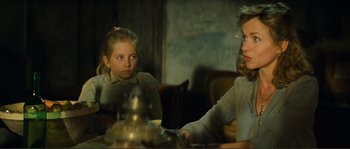 Movie still from “Jean de Florette” (1986), directed by Claude Berri – Two young girls sitting at a table with a tea pot in front of them; Close Up shot, Over the shoulder angle