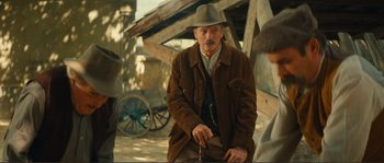 Movie still from “Jean de Florette” (1986), directed by Claude Berri – An old man in a brown jacket and a brown hat; Medium shot, Over the shoulder angle