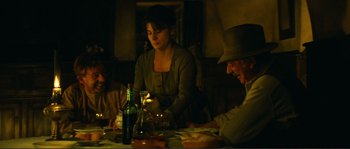Movie still from “Jean de Florette” (1986), directed by Claude Berri – A group of people sitting around a table; Medium shot, High angle