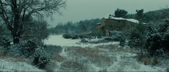 Movie still from “Jean de Florette” (1986), directed by Claude Berri – An old house in the middle of a snowy field; Extreme Wide shot, High angle
