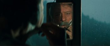 Movie still from “Jean de Florette” (1986), directed by Claude Berri – A man with a mustache looking into a mirror; Close Up shot, Over the shoulder angle