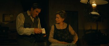 Movie still from “Jean de Florette” (1986), directed by Claude Berri – A man and a woman sitting next to each other; Medium shot, Over the shoulder angle