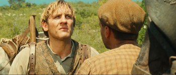 Movie still from “Jean de Florette” (1986), directed by Claude Berri – Two men talking to each other outside in the wilderness; Close Up shot, Over the shoulder angle