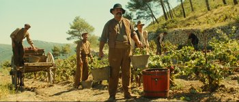 Movie still from “Jean de Florette” (1986), directed by Claude Berri – A group of men standing next to each other on top of a hill; Wide shot, Low angle