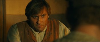 Movie still from “Jean de Florette” (1986), directed by Claude Berri – A person wearing a vest; Close Up shot, Over the shoulder angle