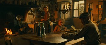 Movie still from “Jean de Florette” (1986), directed by Claude Berri – A woman and a little girl are in a kitchen; Wide shot, High angle