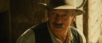 Movie still from “Jean de Florette” (1986), directed by Claude Berri – An older man with a hat and a mustache; Close Up shot, Over the shoulder angle
