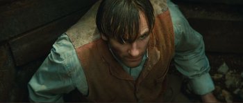 Movie still from “Jean de Florette” (1986), directed by Claude Berri – A person wearing a jacket; Close Up shot, High angle