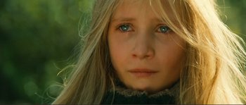 Movie still from “Jean de Florette” (1986), directed by Claude Berri – A young girl's face with blue eyes; Close Up shot, High angle
