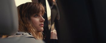 Movie still from “Jem and the Holograms” (2015), directed by Jon M. Chu – A person sitting on a bus; Close Up shot, High angle