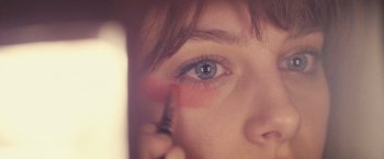 Movie still from “Jem and the Holograms” (2015), directed by Jon M. Chu – A woman's eye with a brush; Extreme Close Up shot, Overhead angle