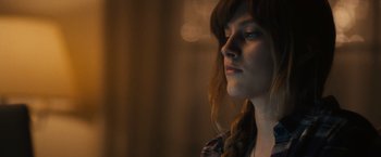 Movie still from “Jem and the Holograms” (2015), directed by Jon M. Chu – A person with long brown hair; Close Up shot, Over the shoulder angle