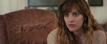 Movie still from “Jem and the Holograms” (2015), directed by Jon M. Chu – A person sitting in a chair; Close Up shot, Over the shoulder angle