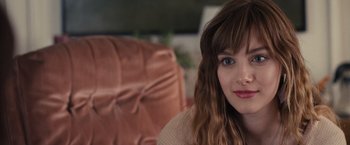 Movie still from “Jem and the Holograms” (2015), directed by Jon M. Chu – A person sitting in a chair; Close Up shot, Over the shoulder angle