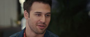 Movie still from “Jem and the Holograms” (2015), directed by Jon M. Chu – A person with a beard; Close Up shot, Over the shoulder angle