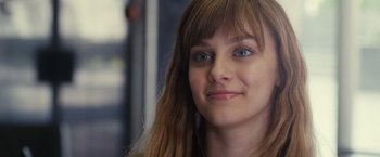 Movie still from “Jem and the Holograms” (2015), directed by Jon M. Chu – A person with long brown hair; Close Up shot, Over the shoulder angle