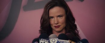 Movie still from “Jem and the Holograms” (2015), directed by Jon M. Chu – A person talking on a microphone with microphones; Close Up shot, Over the shoulder angle