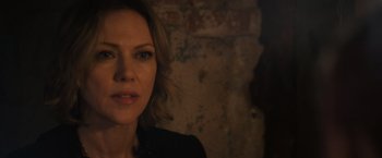 Movie still from “Jem and the Holograms” (2015), directed by Jon M. Chu – A woman's face in front of a brick wall; Close Up shot, Over the shoulder angle