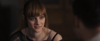 Movie still from “Jem and the Holograms” (2015), directed by Jon M. Chu – A person wearing a black shirt; Close Up shot, Over the shoulder angle