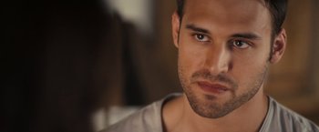 Movie still from “Jem and the Holograms” (2015), directed by Jon M. Chu – A man's face in a room; Close Up shot, Over the shoulder angle