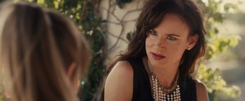 Movie still from “Jem and the Holograms” (2015), directed by Jon M. Chu – A person wearing a necklace; Close Up shot, Over the shoulder angle