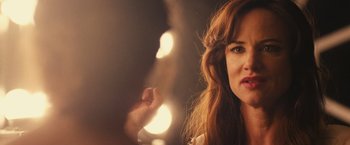 Movie still from “Jem and the Holograms” (2015), directed by Jon M. Chu – A person with long brown hair; Close Up shot, Over the shoulder angle