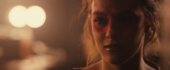 Movie still from “Jem and the Holograms” (2015), directed by Jon M. Chu – A woman's face in a dimly - lit room; Close Up shot, Over the shoulder angle