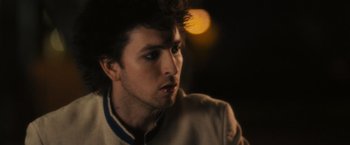 Movie still from “Jem and the Holograms” (2015), directed by Jon M. Chu – A person wearing a jacket; Close Up shot, Over the shoulder angle