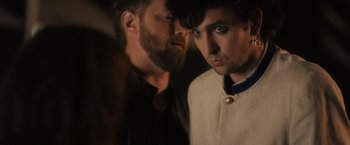 Movie still from “Jem and the Holograms” (2015), directed by Jon M. Chu – A man and a woman standing next to each other; Close Up shot, Over the shoulder angle