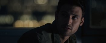 Movie still from “Jem and the Holograms” (2015), directed by Jon M. Chu – A person wearing a jacket; Close Up shot, Over the shoulder angle