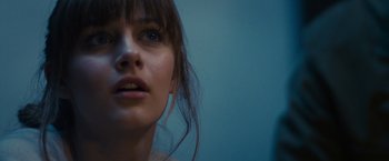 Movie still from “Jem and the Holograms” (2015), directed by Jon M. Chu – A woman's face in front of a blue background; Close Up shot, Low angle