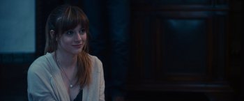 Movie still from “Jem and the Holograms” (2015), directed by Jon M. Chu – A young woman is posing for a picture; Close Up shot, Over the shoulder angle