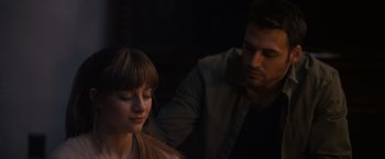 Movie still from “Jem and the Holograms” (2015), directed by Jon M. Chu – A man and a woman sitting next to each other in the dark; Close Up shot, Over the shoulder angle