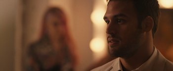 Movie still from “Jem and the Holograms” (2015), directed by Jon M. Chu – A man's face in front of a woman; Close Up shot, Over the shoulder angle