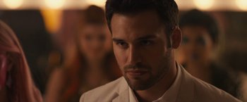 Movie still from “Jem and the Holograms” (2015), directed by Jon M. Chu – A person wearing a white shirt; Close Up shot, Over the shoulder angle