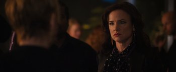 Movie still from “Jem and the Holograms” (2015), directed by Jon M. Chu – A person wearing a black shirt; Close Up shot, Over the shoulder angle