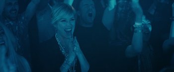 Movie still from “Jem and the Holograms” (2015), directed by Jon M. Chu – A woman clapping her hands in front of a group of people; Medium shot, High angle