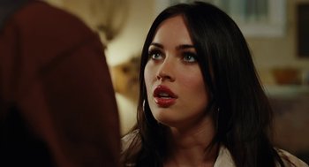 Movie still from “Jennifer's Body” (2009), directed by Karyn Kusama – A person looking at a camera; Close Up shot, Over the shoulder angle