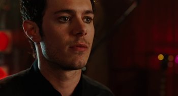 Movie still from “Jennifer's Body” (2009), directed by Karyn Kusama – A person wearing a black shirt; Close Up shot, Over the shoulder angle