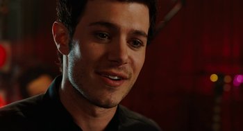 Movie still from “Jennifer's Body” (2009), directed by Karyn Kusama – A person wearing a black shirt; Close Up shot, Over the shoulder angle